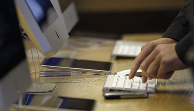 
              A man uses a computer at a computer shop in central London, Wednesday, Nov. 14, 2012. UK Lawyers say the mounting tally of those arrested and convicted of making offensive comments thro
